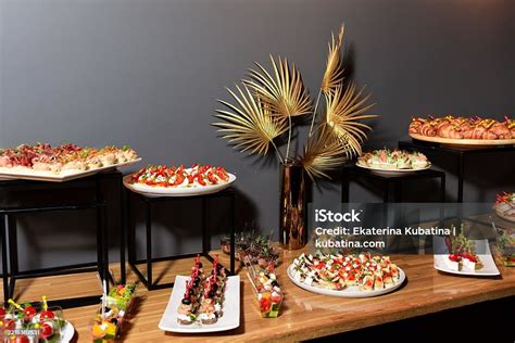 A beautifully arranged table with various canapés for an event