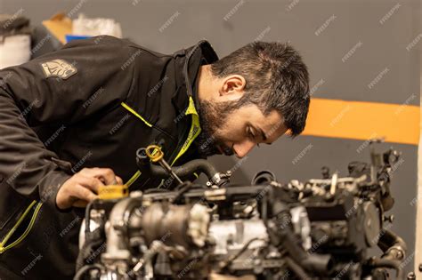 Car mechanic inspecting a Volkswagen engine