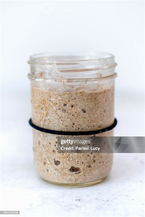 Active sourdough starter in a glass jar