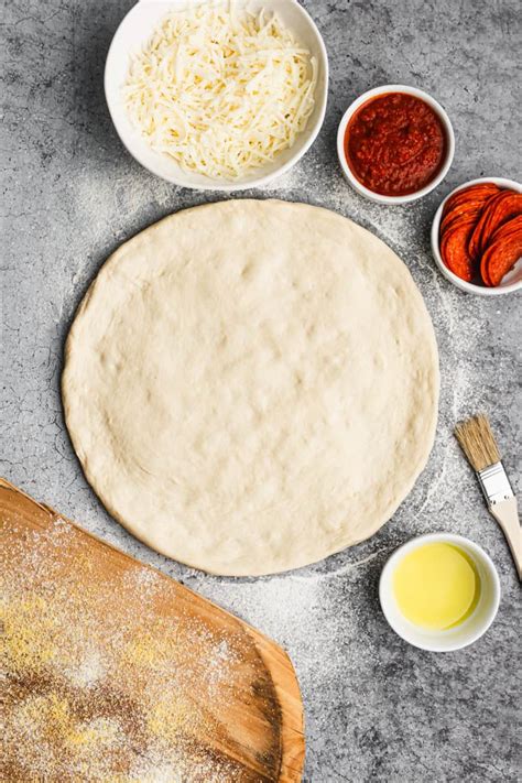Homemade vegan pizza dough being kneaded