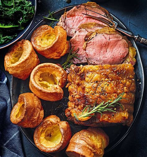 Historical depiction of Yorkshire puddings being made under a roast