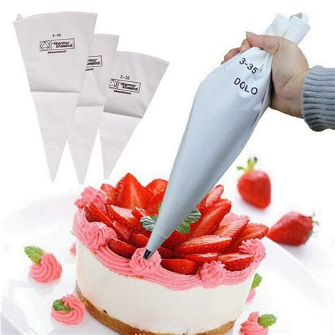 Decorating a layered cake with a pastry bag