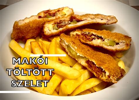Töltött rántott szelet tányéron, körettel