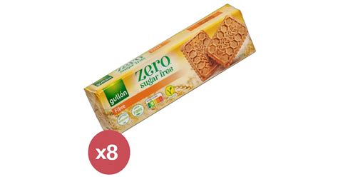 egy tányéron elrendezett Gullón ZERO rostdús kekszek, mellettük teljes kiőrlésű gabonák és friss alapanyagok