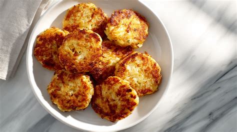 A full meal featuring potato patties