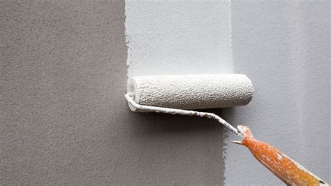 White paint roller on a wall