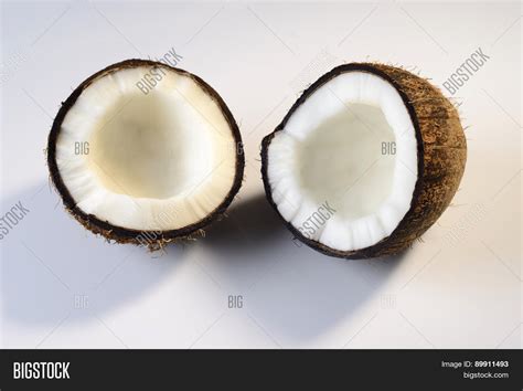 Cross-section of a coconut with milk and flesh