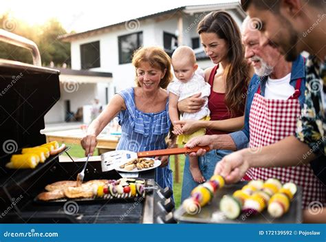people enjoying outdoor grilling