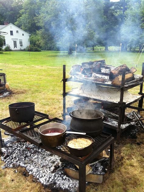 Outdoor cooking with a traditional setup at an event
