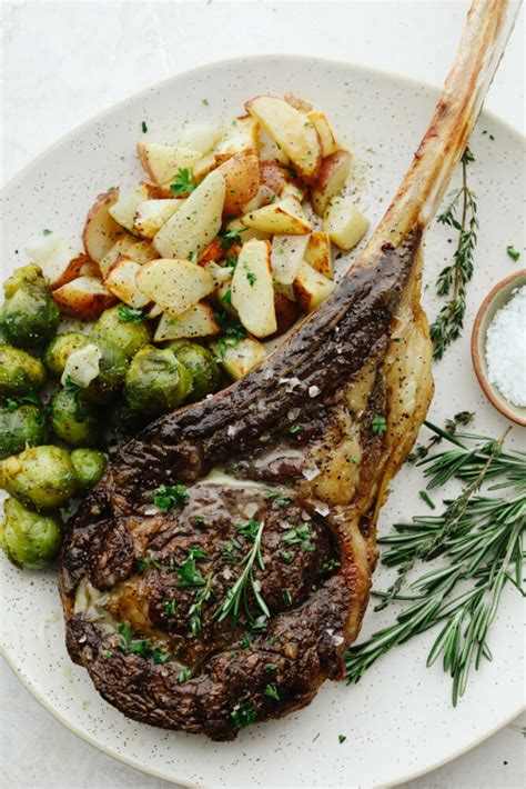Serving Tomahawk steak with side dishes
