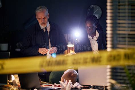 Barnaby and his assistant investigating a crime scene
