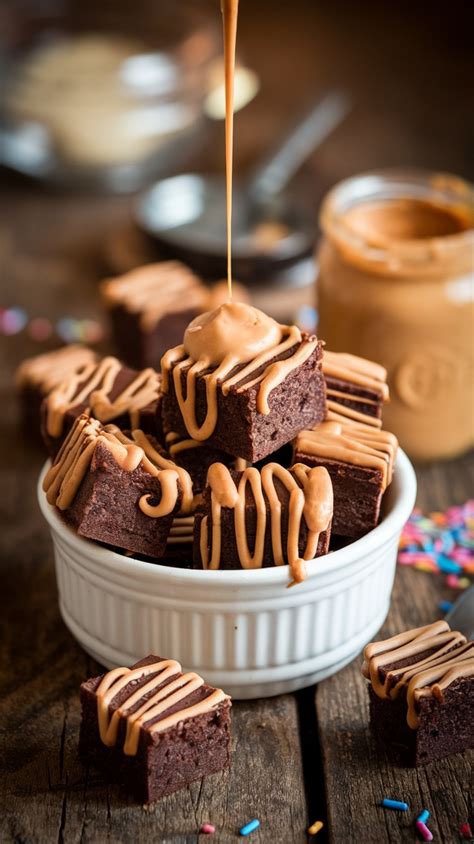 A beautifully baked and sliced peanut butter brownie with a drizzle of peanut butter