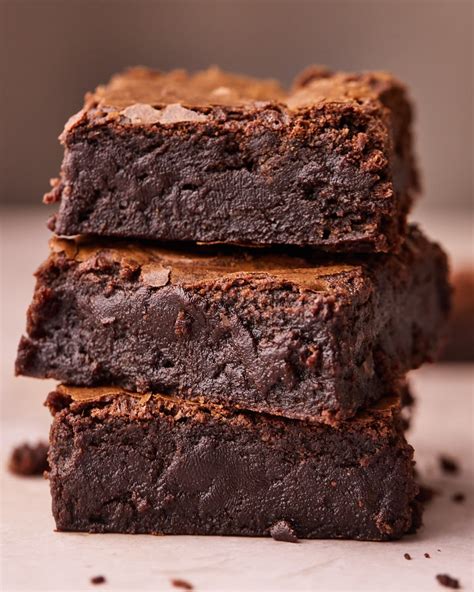 A close-up of a brownie with a slightly gooey, fudgy center, indicating perfect baking