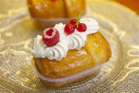 rum baba with cream and fruit
